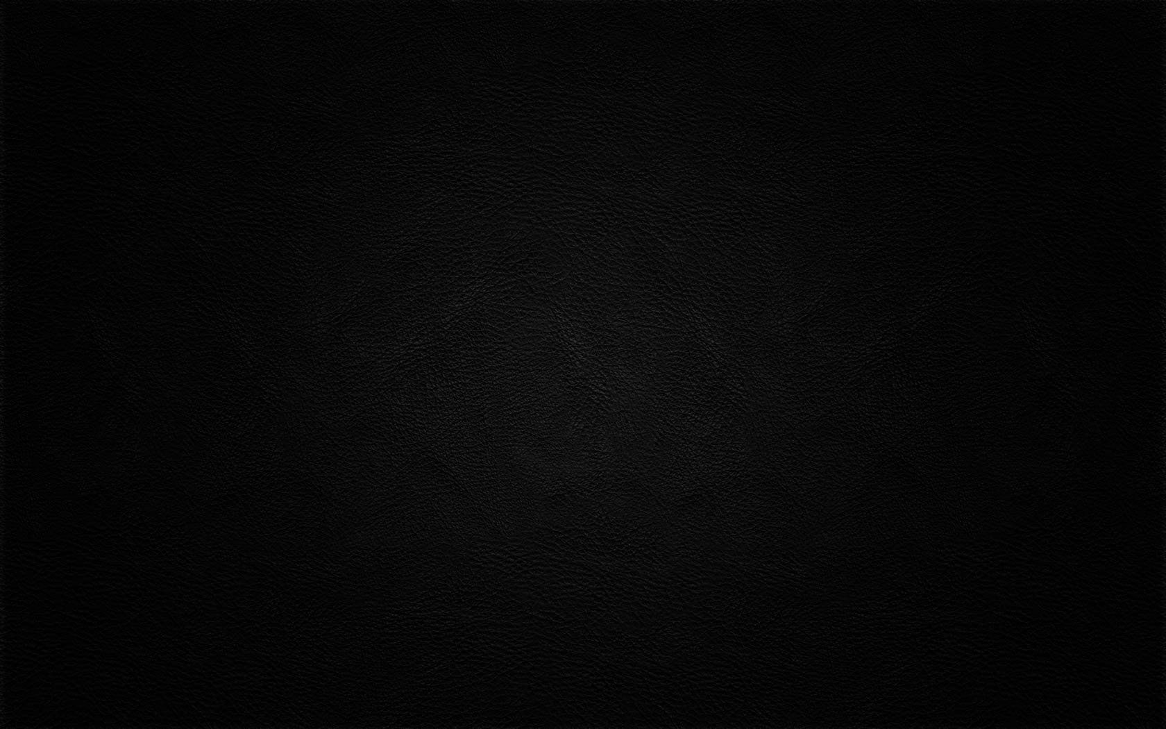 Dark, nearly black abstract background with a faint diagonal light streak and subtle texture